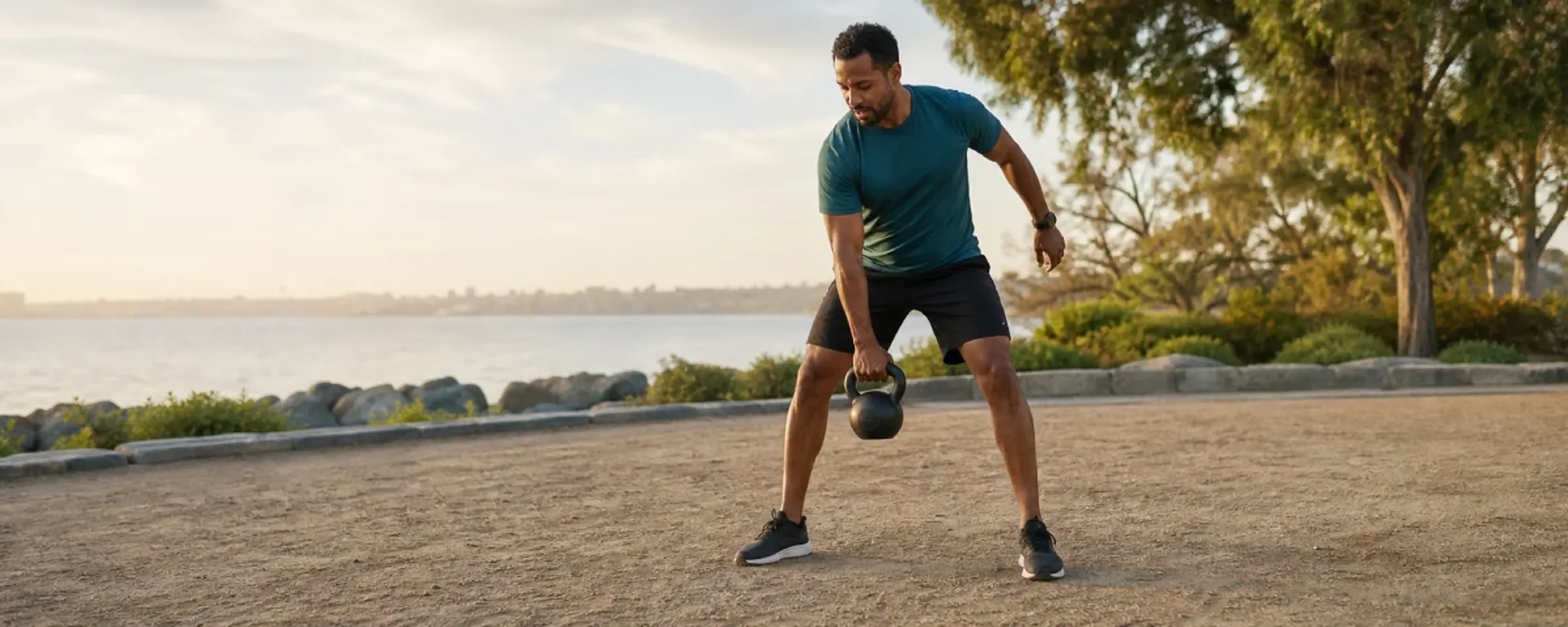 Man training with a kettlebell outdoors